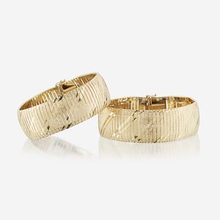 A pair of fourteen karat gold bracelets Italy