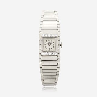 A fourteen karat white gold and diamond, bracelet wristwatch