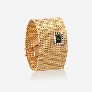 A fourteen karat gold and diamond, bracelet wristwatch