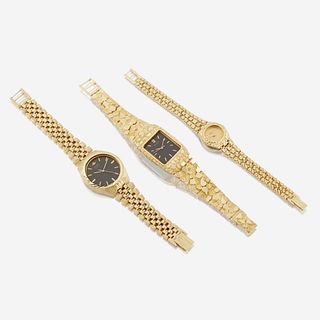 A group of three metal and fourteen karat gold wristwatches, Seiko