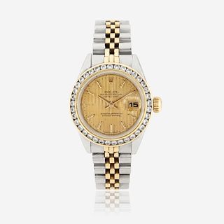 A gold, stainless steel, and diamond, automatic, bracelet wristwatch with date