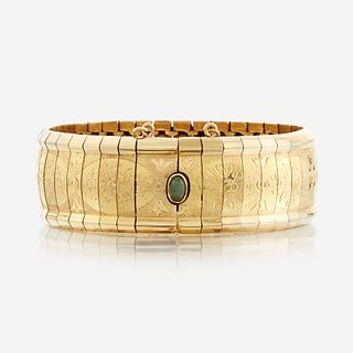 An eighteen karat gold bracelet with gem-set clasp