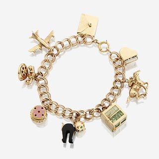 A fourteen karat gold charm bracelet