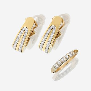 A pair of fourteen karat gold and diamond earrings with similar ring