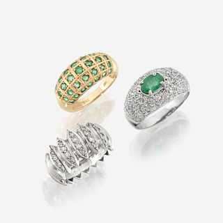 A collection of three fourteen karat gold and gem-set rings
