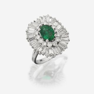 An emerald, diamond, and eighteen karat gold ring