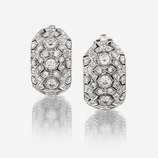 A pair of eighteen karat white gold and diamond earrings
