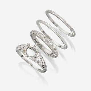 A collection of four platinum rings