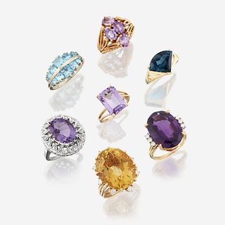 A collection of seven fourteen karat gold and gem-set rings