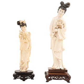 PAIR OF LADIES CHINA, EARLY 20TH CENTURY Ivory carving with ink details. Lady 1: 9.8" (25 cm) in height, Lady 2: 7.4" (19 cm) in height