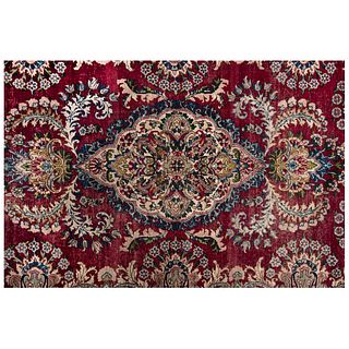 PERSIAN KERMAN Ca. 1900 Handmade in pile of wool on a cotton base with natural dyes. 70.8 x 51.1" (180 x 130 cm)