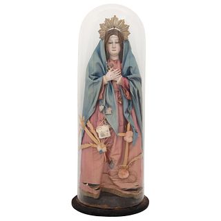 OUR LADY OF SORROWS MEXICO, 19TH CENTURY Polychrome wood carving  Glass eyes and natural hair. 17.9" (45.5 cm) tall