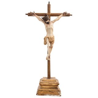 CRUCIFIED CHRIST MEXICO, 19TH CENTURY Carved and polychrome wood, with square pedestal. 40.1 x 20.4" (102 x 52 cm)