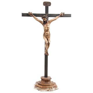 CRUCIFIED CHRIST MEXICO, 19TH CENTURY Carved and polychrome wood, octagonal base. 42.1 x 23.6" (107 x 60 cm)