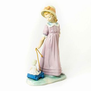 Girl with Toy Wagon 1005044 - Lladro Porcelain Figure