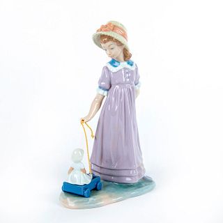 Girl with Toy Wagon 1015044 - Lladro Porcelain Figure