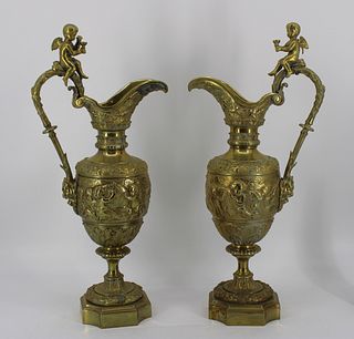 An Antique Pair Of Brass / Bronze Figural Ewers.