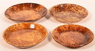 Four Rockingham Glazed Yellowware Plates.