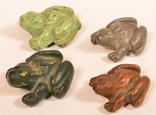 Four Cast Metal Frog Paperweights.