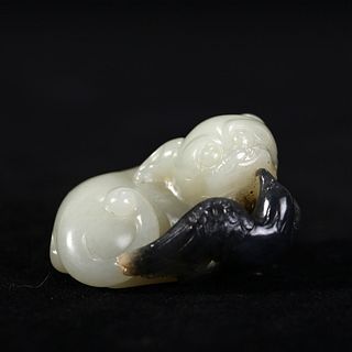 A BLACK AND WHITE JADE CARVING