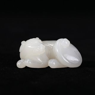 A WHITE JADE 'MYTHICAL BEAST' CARVING