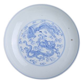 A BLUE AND WHITE 'DRAGON AND PHOENIX' DISH