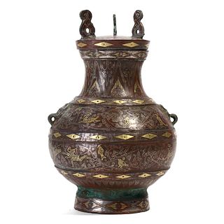 A GOLD AND SILVER-INLAID BRONZE VASE AND COVER