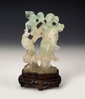 Fairy figure with bird. China, 20th century.
Hand carved jade on wooden base.