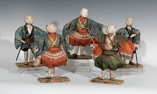 Set of five Samurai warriors; early 20th century.
Wood and silk clothing.