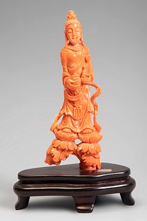 Guanyin; China, 20th century.
Coral.
With wooden base.