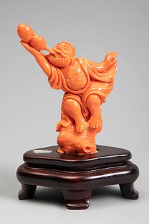 Chinese figure, 20th century.
Coral.
Wooden base.