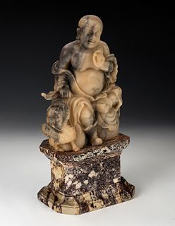 Luohan. China, 19th century.
Soapy stone carved by hand on a veined marble base.