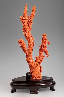 Buddhist group with Kuan Kin. China, 20th century.
In coral with three branches.
Wooden base.