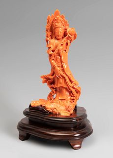 Guanyin. China, 20th century.
Coral.
With wooden base.
