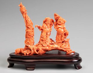 Three deities. China, 20th century.
Coral.
Wooden base.