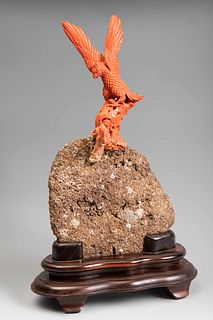 Eagle. China, 20th century.
Coral carving. Stone mound and wooden base.