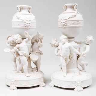 Pair of Continental Biscuit Figural Urns