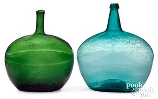 Two glass demijohns, to include aqua and olive gre