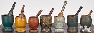 Collection of seven painted mortar and pestles, 19