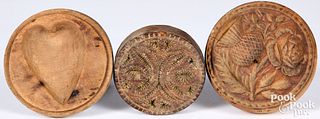 Three carved butterprints, 19th c., largest - 4" d