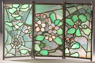 Tiffany Studios "Spider" Tea Screen, having three leaded glass panels with patinated bronze having apple blossom with spider web on ball feet, height 