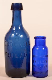 Two Blue Glass Bottles.