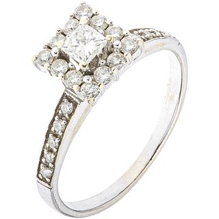 RING WITH DIAMONDS IN 14K WHITE GOLD 1 8x8 cut diamond ~0.24 ct Clarity: I2-13, Brilliant cut diamonds ~0.40 ct