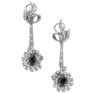 PAIR OF EARRINGS WITH SAPPHIRES AND DIAMONDS IN PALLADIUM SILVER Oval cut sapphires ~1.0 ct, 8x8 cut diamonds ~0.40 ct. Weight: 9.7 g