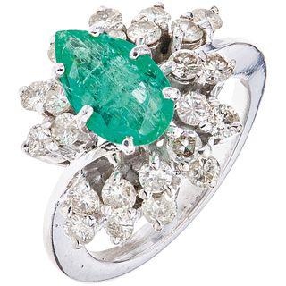 RING WITH EMERALD AND DIAMONDS IN 10K WHITE GOLD 1 Pear cut emerald ~1.0 ct, brilliant cut diamonds ~1.20 ct. Size:7