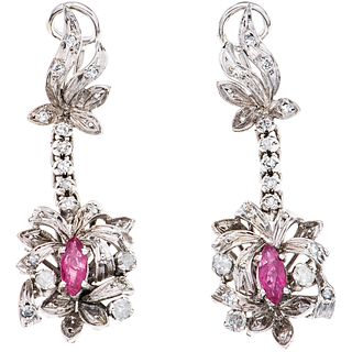 PAIR OF EARRINGS WITH RUBIES AND DIAMONDS IN PALLADIUM SILVER Marquise cut rubies ~0.50 ct, 8x8 cut diamonds ~0.55 ct. Weight: 9.0 g