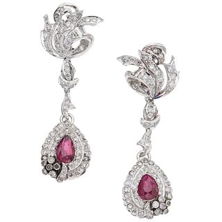 PAIR OF EARRINGS WITH RUBIES AND DIAMONDS IN PALLADIUM SILVER Pear cut rubies ~1.50 ct, 8x8 cut diamonds ~1.30 ct. Weight: 13.2 g