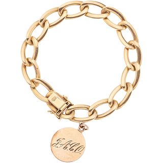 BRACELET IN 18K YELLOW GOLD AND PENDANT IN 10K YELLOW GOLD Weight: 30.8 g