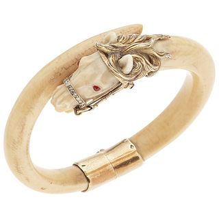 BRACELET WITH IVORY AND DIAMONDS IN 18K YELLOW GOLD In manner of horse with 8x8 cut diamonds ~0.10 ct. Weight: 42.5 g