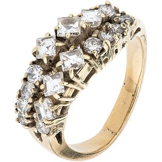 RING WITH DIAMONDS IN 14K YELLOW GOLD Baguette and brilliant cut diamonds ~1.20 ct. Weight: 5.3 g. Size: 6 ¾